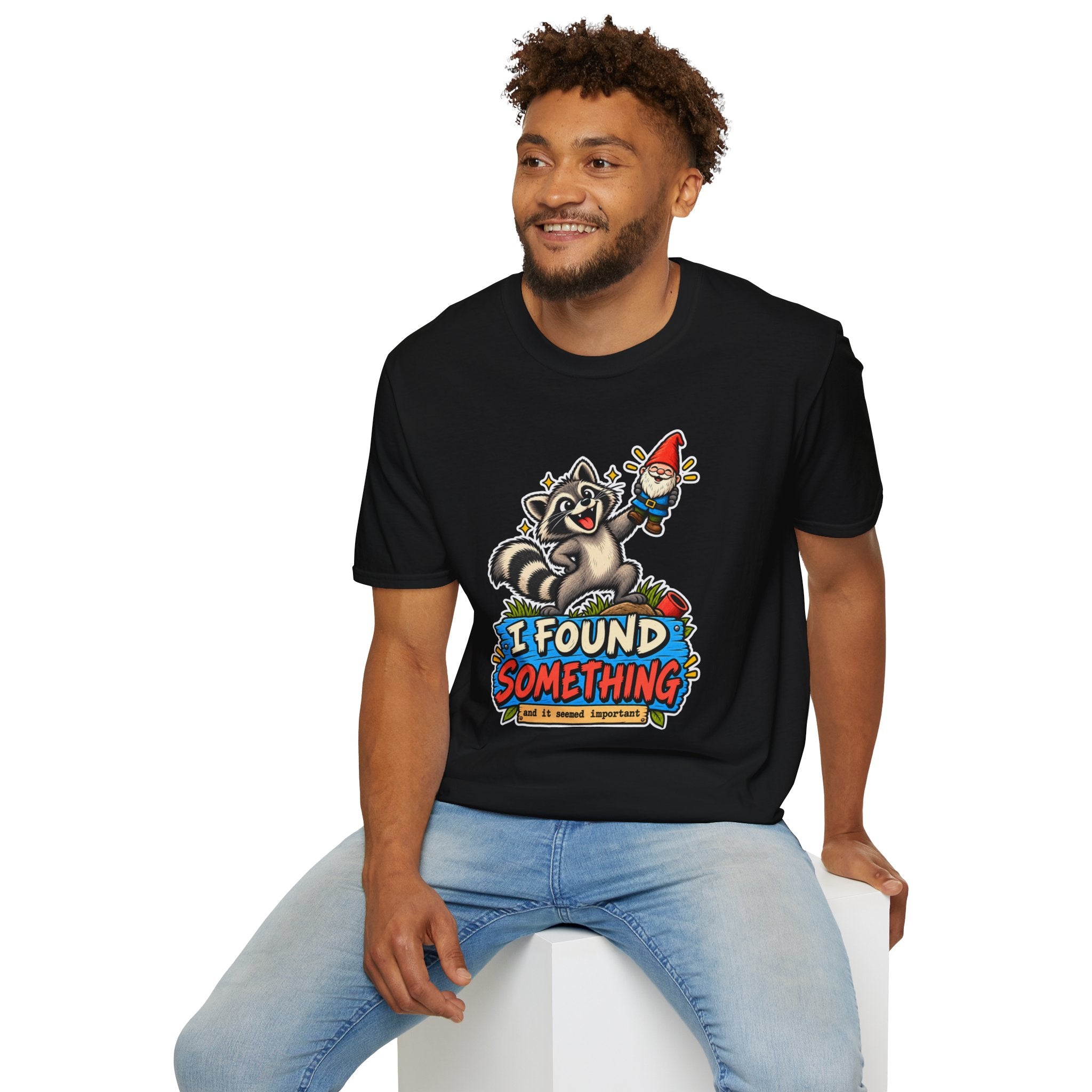 Playful Raccoon Holding Garden Gnome T-Shirt | I Found Something Graphic Tee