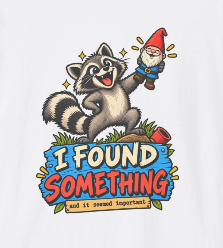 Playful Raccoon Holding Garden Gnome T-Shirt | I Found Something Graphic Tee